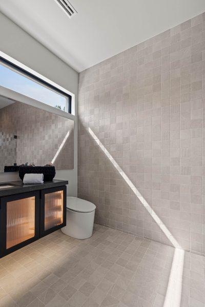 Zbranek Holt LakeLBJ Modern Luxury Lakehouse Bathroom TileWall Sunlight Vanity