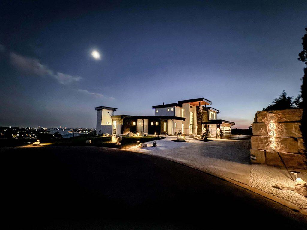 Modern Luxury Hill Top Exterior Lighting Night Skyline Views Stone Accents Zbranek and Holt Custom Homes