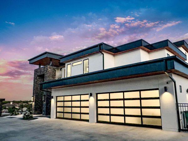 Modern Luxury Hill Top Garage Frosted Glass Doors Stone Accents Zbranek and Holt Custom Homes