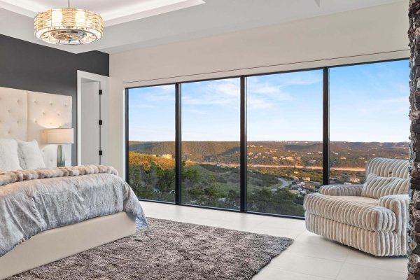 Modern Luxury Hill Top Master Bedroom Tray Ceiling Lake Travis Panoramic View Zbranek and Holt Custom Homes