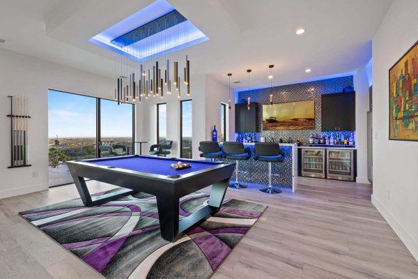 Modern Luxury Hill Top game room bar full wall glass hill country views Zbranek and Holt Custom Homes