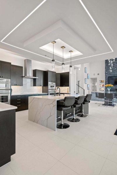 Modern Luxury Hill Top kitchen open floor plan quartz island dark cabinetry Zbranek and Holt Custom Homes