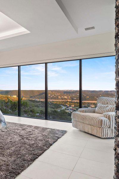 Modern Luxury Hill Top master bedroom panoramic view floor to ceiling windows Zbranek and Holt Custom Homes