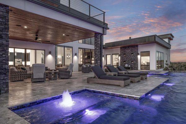 Modern Luxury Hill Top pool outdoor living stone cladding wood ceiling Zbranek and Holt Custom Homes