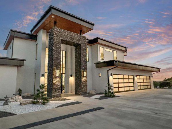 Modern Luxury Hill Top stacked stone entryway white stucco Zbranek and Holt Custom Homes